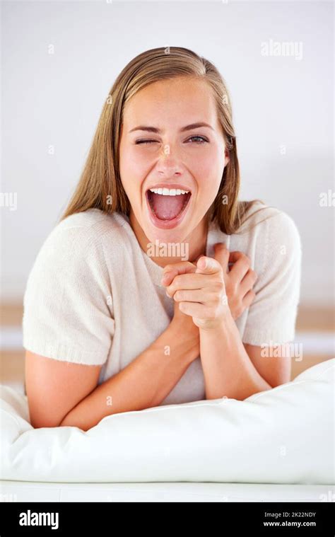 Sure Thing Wink Wink Portrait Of An Attractive Young Woman Pointing