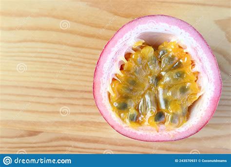 Half Cut Fresh Ripe Passion Fruit Isolated On Wooden Background Stock