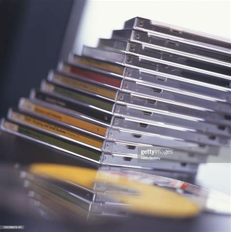 Stack Of Compact Discs On Desk Closeup Surface View High Res Stock