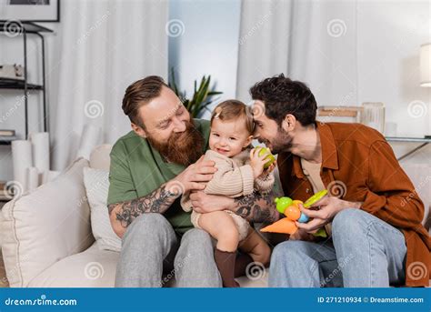 Happy Gay Couple Holding Baby Girl Stock Photo Image Of Fresh Apple 271210934