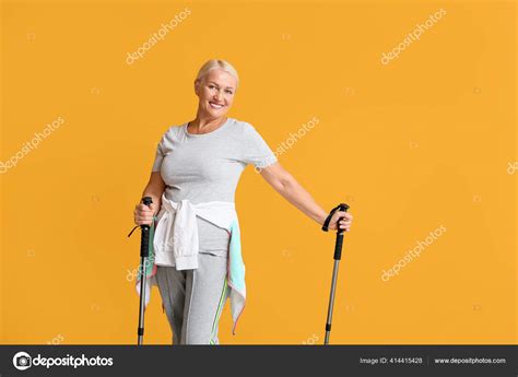 Mature Woman Walking Poles Color Background Stock Photo By Serezniy