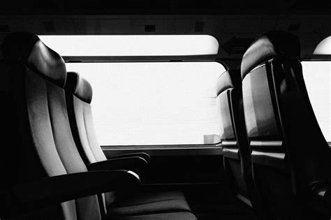 Grayscale Photography of Train Car Interior · Free Stock Photo