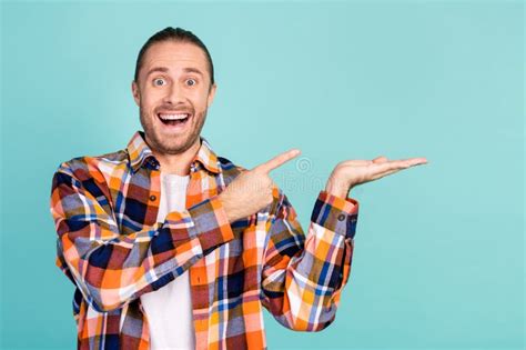 Photo Of Overjoyed Impressed Man Dressed Checkered Shirt Directing At Awesome Offer On Palm