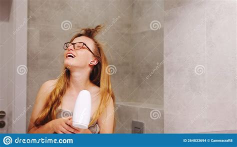 Beautiful Brunette Woman Using A Blow Dryer To Dry Her Hair Stock Photo Image Of Natural