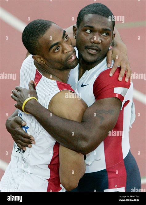 Tyson Gay Of The Us Left Embraces Countryman Justin Gatlin After They Finished First And
