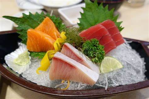 Sashimi Sushi Slice Of Fresh Raw Fish Salmon Hamachi Maguro On Ice