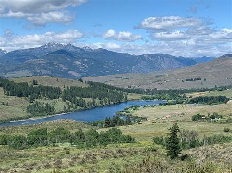 a scenic view of the mountains and river