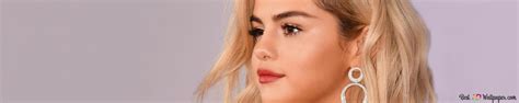 Selena Gomez Blonde Hair With Black Leather Jacket On Purple Background