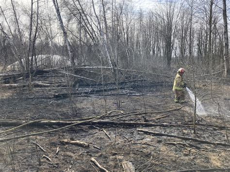 Firefighters Contend With Strong Winds While Battling Large Brush Fire