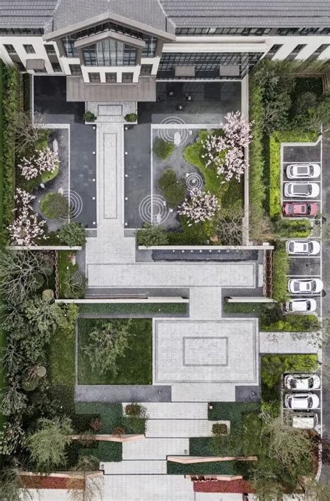 An Aerial View Of A House With Lots Of Trees And Bushes In The Front Yard