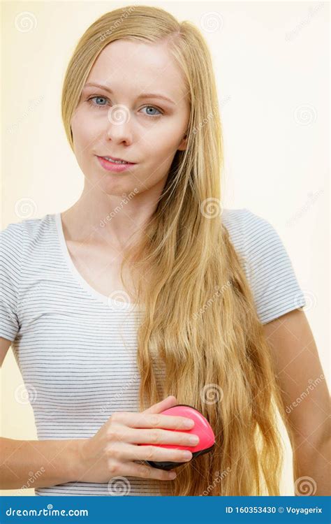 Blonde Girl Brushing Her Long Hair Stock Photo Image Of Long Cosmetic