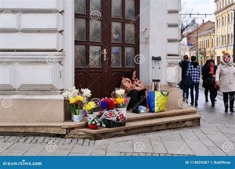 Old Disabled Woman Sells Flowers On The Street Corner Editorial