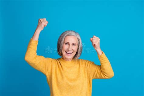 Photo Of Delighted Overjoyed Person Raise Fists Luck Accomplishment