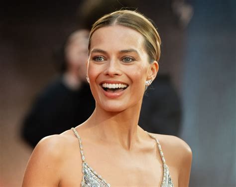 Margot Robbie Wears Nothing But Tiny String Bra With Unzipped Jacket