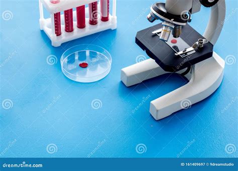 Blood Testing Laboratory Samples Viewing Under Microscope Near Tubes