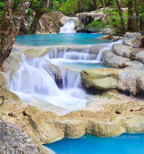 Waterfall and blue stream in the forest — Stock Photo © Deerphoto #38121017