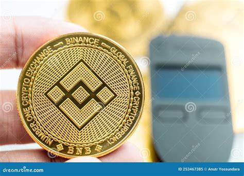 Hand Holding A Binance Smart Chain Cryptocurrency Bnb Coin With