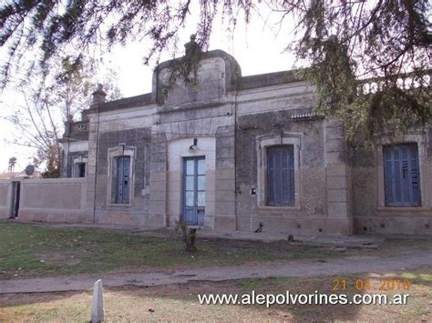 An Old Stone Building With Blue Doors And Windows On The Front Porch Is