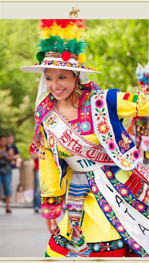 a woman dressed in colorful clothing and hat
