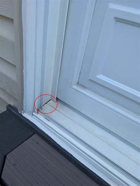 caulking - Should the corners of a sliding patio door frame be caulked