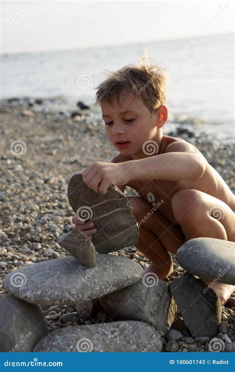 Boy Playing On Pebble Beach Stock Image Image Of Cheerful Outside