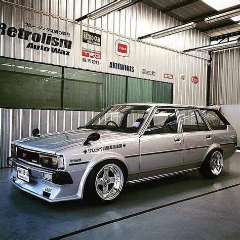 An Old Station Wagon Is Parked In A Garage