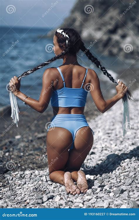 Tanned And Slim Brunette Resting At A Tropical Resort Stock Image