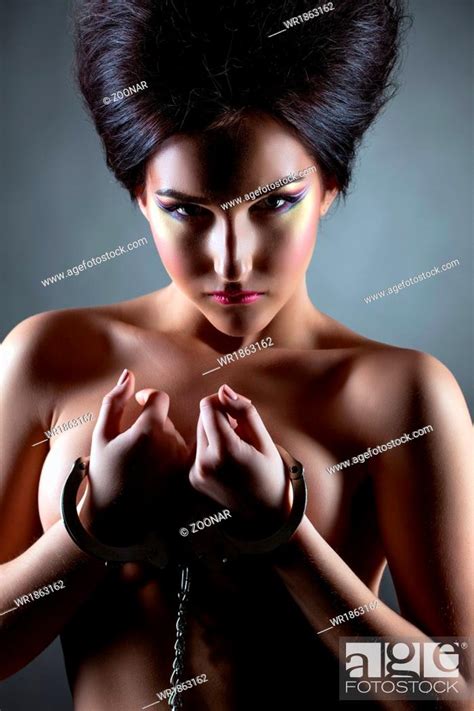 Shot Of Beautiful Nude Brunette Posing Handcuffed Stock Photo Picture And Royalty Free Image
