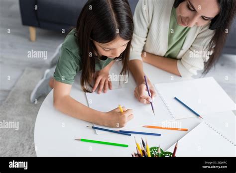 Cute Brunette Girl Drawing On Hi Res Stock Photography And Images Alamy