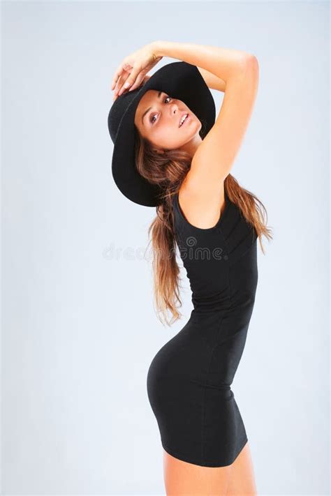 Ready To Cause A Stir A Gorgeous Brunette In A Black Dress Stock Image Image Of Gorgeous