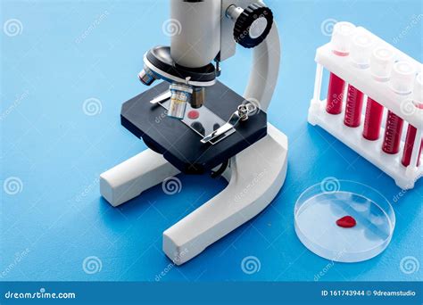 Blood Testing Laboratory Samples Viewing Under Microscope Near Tubes