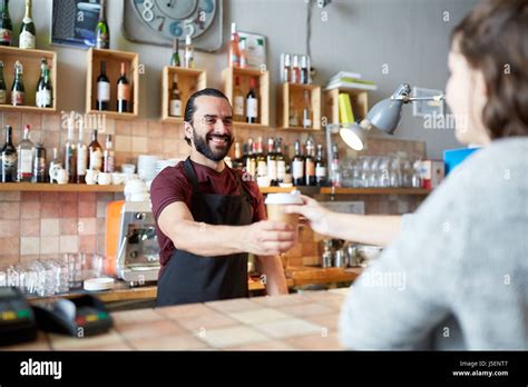 Man Or Waiter Serving Customer In Coffee Shop Stock Photo Alamy