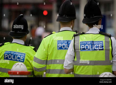 Officers From The City Of London Police Man A Checkpoint Looking For