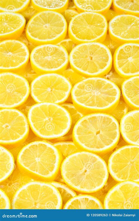 A Slices Of Fresh Juicy Yellow Lemons Texture Background Patt Stock