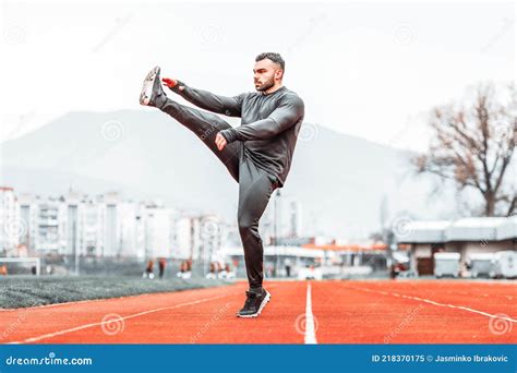 Handsome Man Stretching Before Exercising Outside Running Stock Image