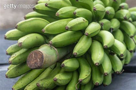 Green Bananas On A Market Stall Close Up Of A Bunch Of Bananas