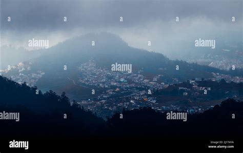 A beautiful shot of Ooty village view from Doddabetta peak under a ...