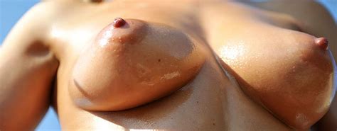 Bikini Babe Gets Oiled Up In The Sun