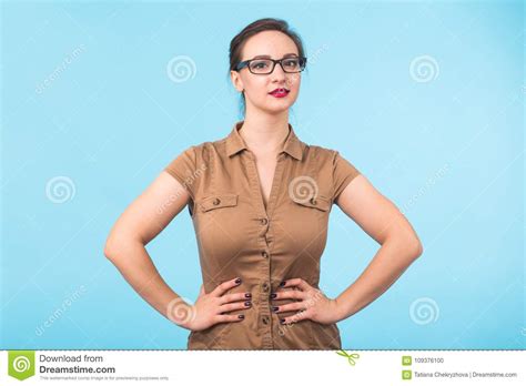 Elegant Cheerful Brunette In Eyeglasses Smiling At Camera On Blue Background With Copy Space