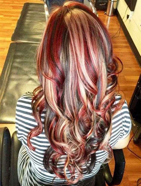 Curly Red Hair With Chunky Blonde Highlights