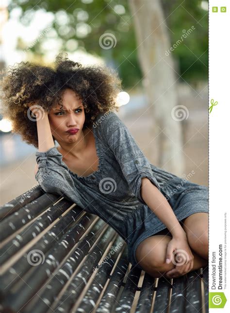 Young Black Woman With Afro Hairstyle Smiling In Urban Background Stock