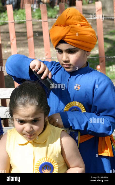 Sikh boy combing his sister s hair at a Sikh festival in New York City ...