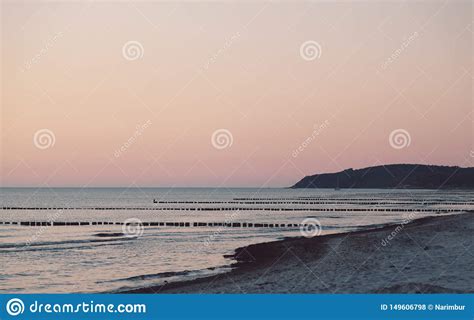 Sunset Over the Beach with Rows of Groins Stock Photo - Image of ...