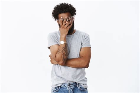 Free Photo Embarrassed Man Facepalm And Smiling