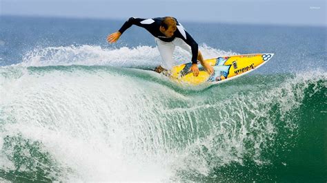 Surfer Riding A Foamy Wave Wallpaper Sport Wallpapers 53773