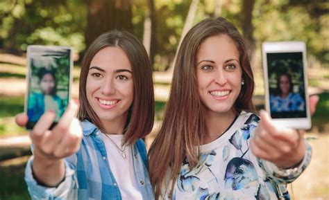 Premium Photo Portrait Of Two Women Taking Selfie Photos With Their