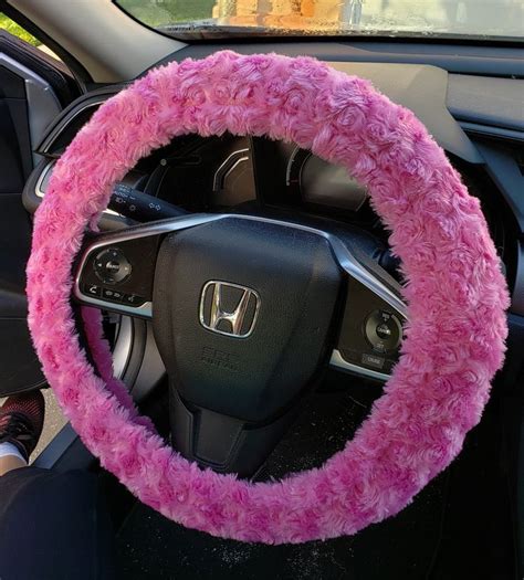 The Steering Wheel Cover Is Covered With Pink Fur