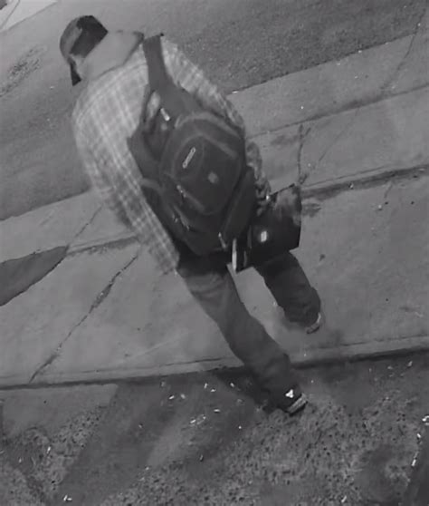 Calgary Police Release Updated Photos Of Suspect In City Hall Arson