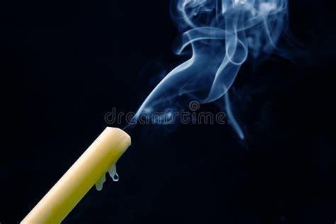 Smoke From An Extinguished Candle On A Dark Background The Concept Of