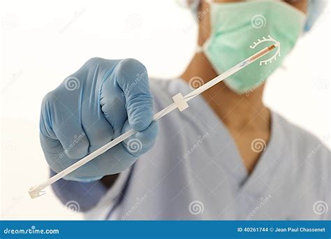 Young Doctor Holding an IUD Birth Control Copper Coil Device in Hand ...